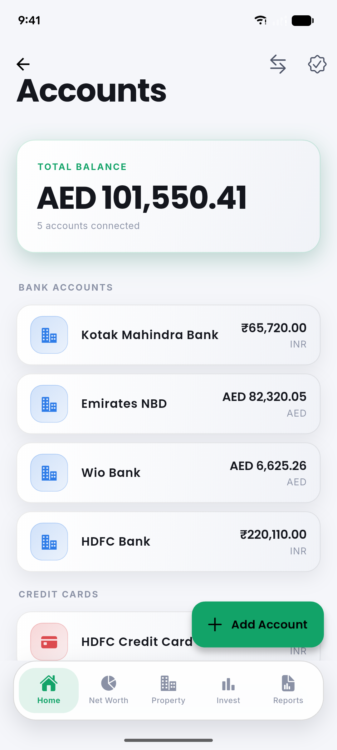 Accounts screen listing banks and credit cards in their native currencies